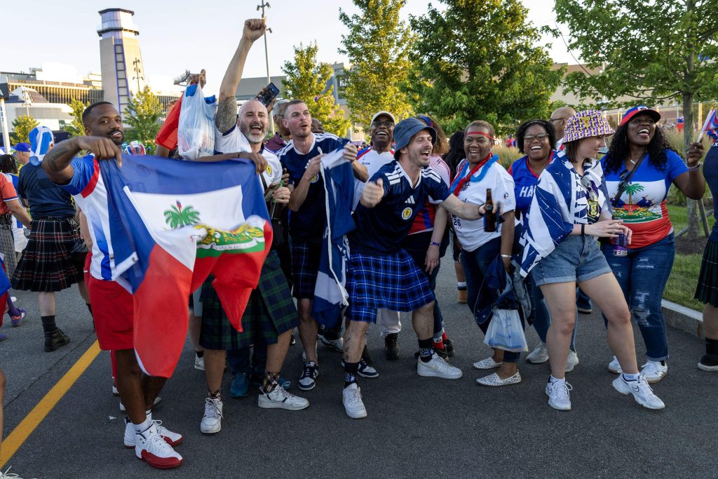 Haiti and Scotland fans sing together before the first game of the 2026 Men's Soccer World Cup to be played in Foxborough, Mass. (Robin Lubbock/WBUR)