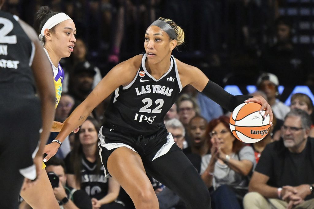 A'ja Wilson, #22 of the Las Vegas Aces, dribbles the ball during a game.
