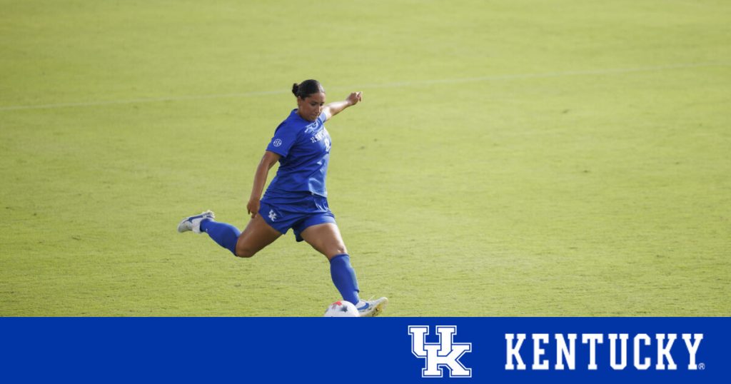 Nadia Ramadan kicks the ball.
